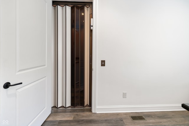 860 Chatham Hills Blvd, Westfield, IN 46074 - unfurnished room with elevator, wood finished floors, and baseboards