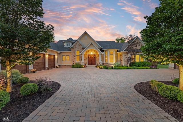 860 Chatham Hills Blvd, Westfield, IN 46074 - view of front of property with curved driveway, stone siding, and a garage