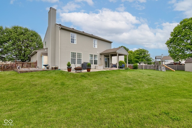 7452 Lace Bark Ct, Avon, IN 46123 - back of house featuring a chimney, a patio area, and a playground
