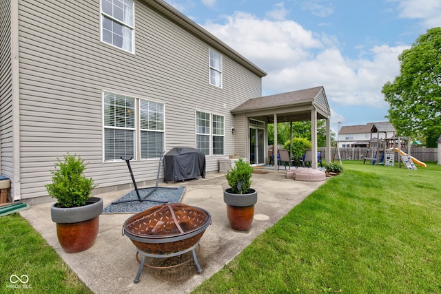 7452 Lace Bark Ct, Avon, IN 46123 - rear view of property featuring a fire pit, a patio area, and a playground