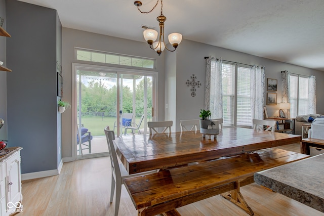 7452 Lace Bark Ct, Avon, IN 46123 - dining area with plenty of natural light, light wood-style flooring, a chandelier, and baseboards