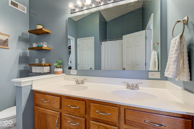 7452 Lace Bark Ct, Avon, IN 46123 - bathroom with double vanity, toilet, and a shower with curtain