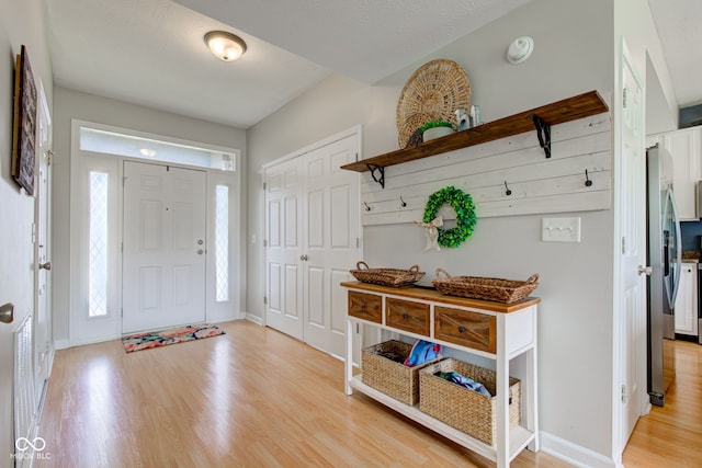 7452 Lace Bark Ct, Avon, IN 46123 - foyer with light wood-style flooring and baseboards