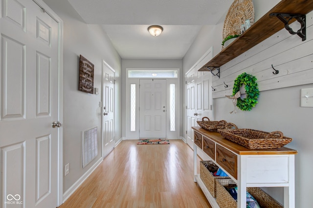 7452 Lace Bark Ct, Avon, IN 46123 - foyer entrance with light wood-type flooring and baseboards