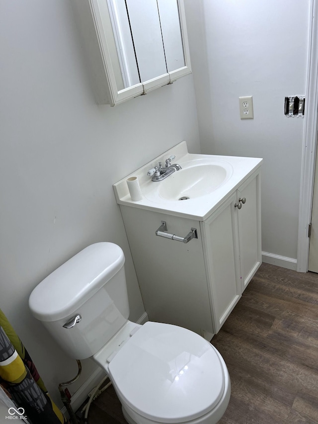 261 S Main St, Marshall, IN 47859 - bathroom featuring toilet, vanity, and wood finished floors