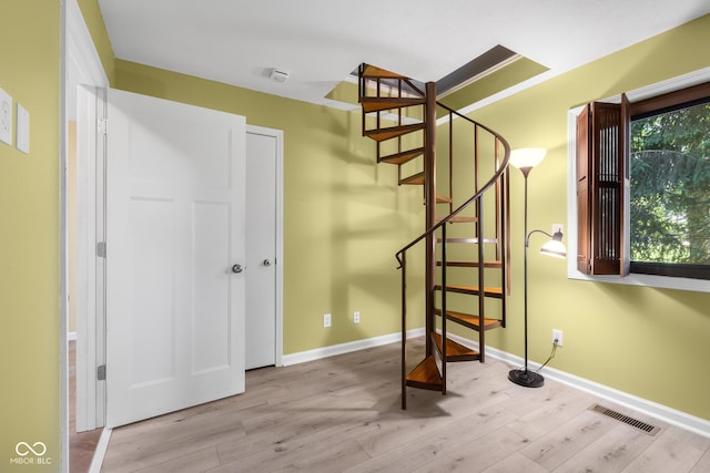 740 Carya Sq, Columbus, IN 47201 - staircase featuring wood finished floors and baseboards