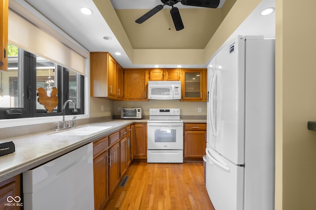 740 Carya Sq, Columbus, IN 47201 - kitchen with white appliances, a sink, brown cabinetry, light countertops, and recessed lighting