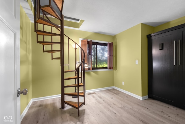 740 Carya Sq, Columbus, IN 47201 - foyer featuring light wood-type flooring, stairway, and baseboards