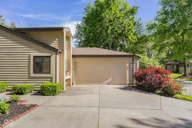 740 Carya Sq, Columbus, IN 47201 - view of front of house with an attached garage and driveway