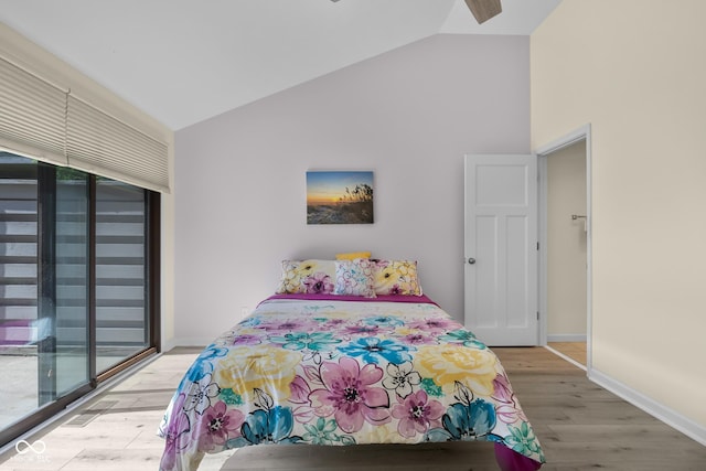 740 Carya Sq, Columbus, IN 47201 - bedroom featuring lofted ceiling, access to exterior, light wood-style floors, baseboards, and a ceiling fan