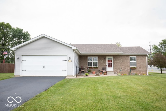 1931 Westbrook Dr, North Vernon, IN 47265 - ranch-style house featuring driveway, an attached garage, brick siding, and a shingled roof
