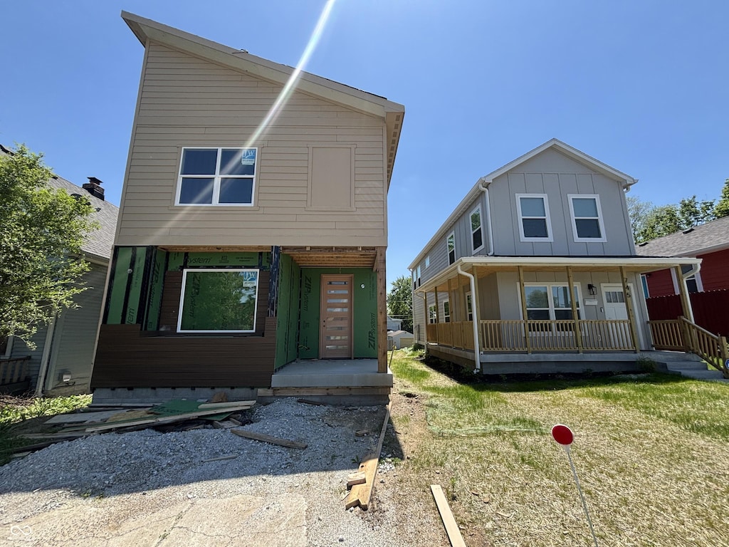 741 W Roache St, Indianapolis, IN 46208 - view of front of house with covered porch and board and batten siding