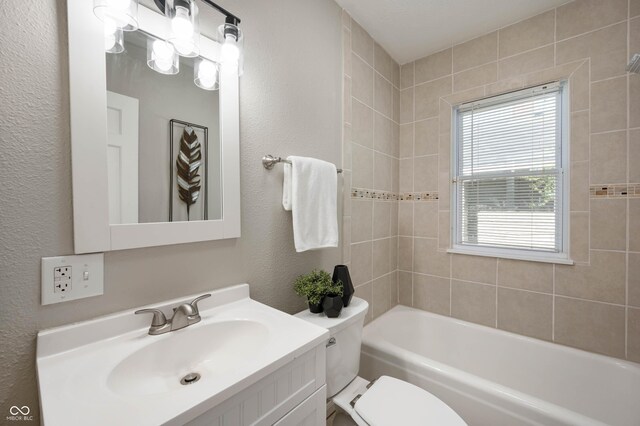 5232 E 10th St, Indianapolis, IN 46219 - bathroom featuring toilet, a textured wall, and vanity