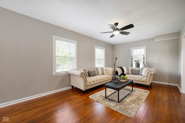 5232 E 10th St, Indianapolis, IN 46219 - living area with baseboards, dark wood-type flooring, and ceiling fan