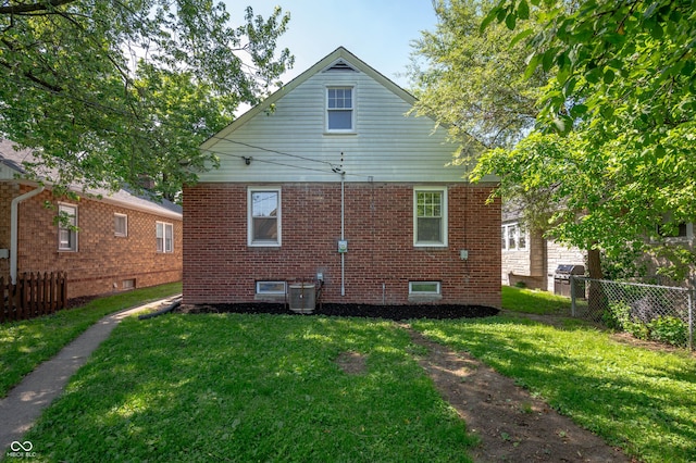 5232 E 10th St, Indianapolis, IN 46219 - rear view of property featuring brick siding