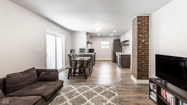 1342 N Oakland Ave, Indianapolis, IN 46201 - living room featuring dark wood finished floors, baseboards, and recessed lighting