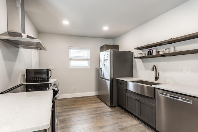 1342 N Oakland Ave, Indianapolis, IN 46201 - kitchen featuring stainless steel appliances, a sink, wall chimney exhaust hood, light countertops, and open shelves