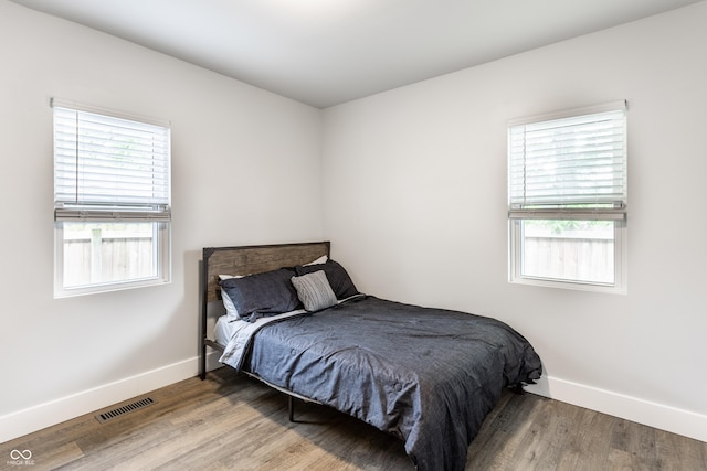 1342 N Oakland Ave, Indianapolis, IN 46201 - bedroom featuring baseboards and wood finished floors