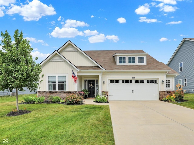 247 Verdant Dr, Cicero, IN 46034 - view of front facade with brick siding, board and batten siding, driveway, and a front yard