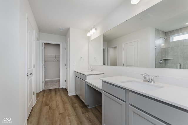 2705 Penn Ave, Plainfield, IN 46168 - full bath featuring vanity, a stall shower, wood finished floors, and a walk in closet