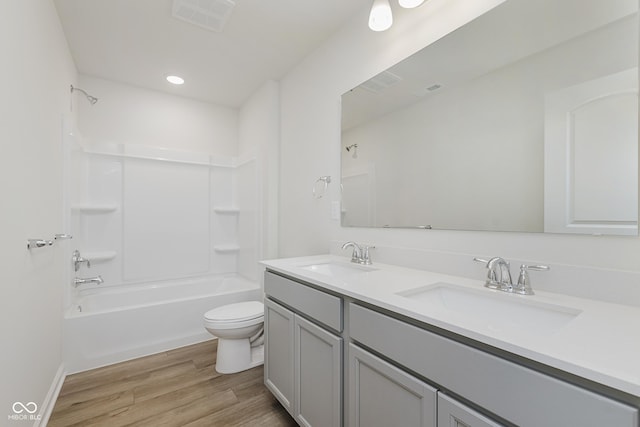 2705 Penn Ave, Plainfield, IN 46168 - bathroom featuring double vanity, bathing tub / shower combination, wood finished floors, and recessed lighting