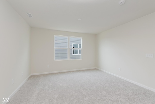 2705 Penn Ave, Plainfield, IN 46168 - empty room featuring light carpet and a smoke detector