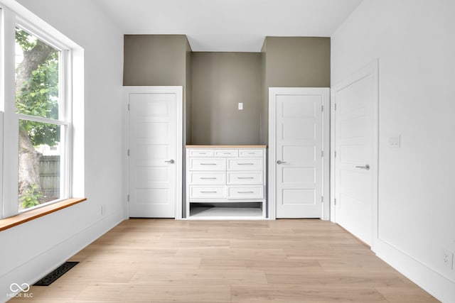 19 E Regent St, Indianapolis, IN 46225 - unfurnished bedroom featuring light wood-style flooring