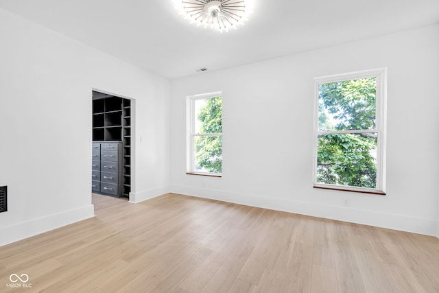 19 E Regent St, Indianapolis, IN 46225 - unfurnished room featuring light wood-style flooring and baseboards