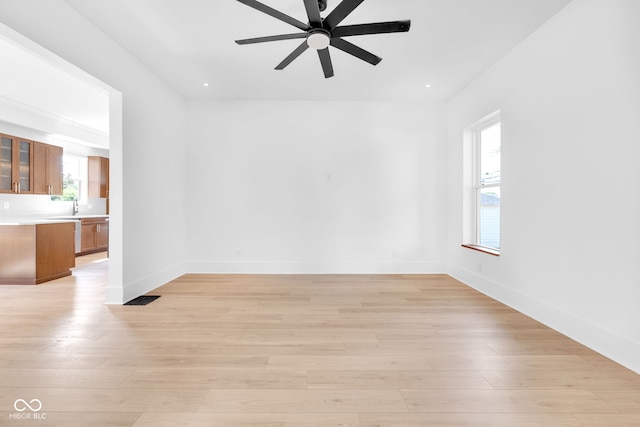 19 E Regent St, Indianapolis, IN 46225 - empty room featuring ceiling fan, light wood finished floors, a sink, baseboards, and recessed lighting