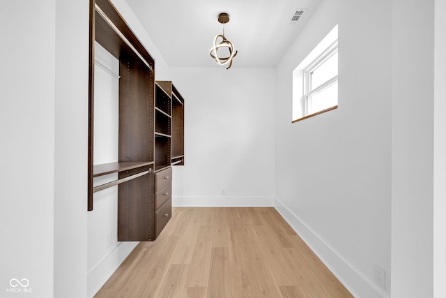 19 E Regent St, Indianapolis, IN 46225 - walk in closet with light wood-type flooring