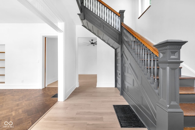 19 E Regent St, Indianapolis, IN 46225 - staircase with wood finished floors, ceiling fan, and baseboards