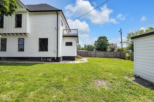 19 E Regent St, Indianapolis, IN 46225 - back of property featuring a balcony and a shingled roof