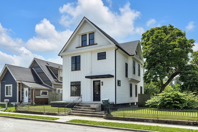 19 E Regent St, Indianapolis, IN 46225 - view of front of property featuring board and batten siding and roof with shingles