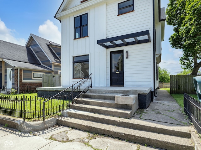 19 E Regent St, Indianapolis, IN 46225 - view of front of house featuring board and batten siding