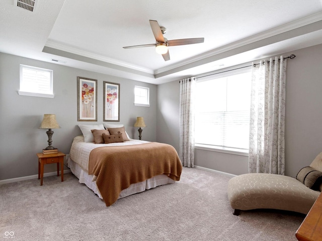 19657 Astoria Ave, Sheridan, IN 46069 - bedroom featuring a tray ceiling, ornamental molding, light carpet, baseboards, and a ceiling fan
