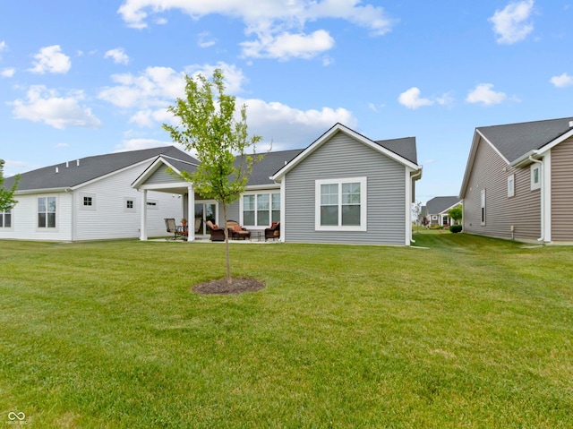 19657 Astoria Ave, Sheridan, IN 46069 - rear view of house with a patio and a lawn