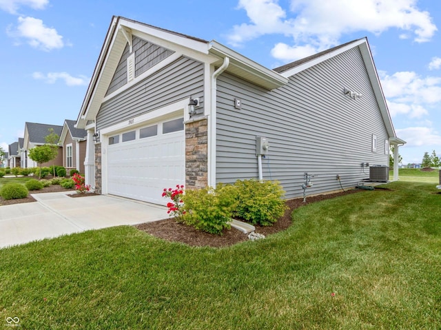 19657 Astoria Ave, Sheridan, IN 46069 - view of property exterior with central AC, driveway, an attached garage, a lawn, and stone siding