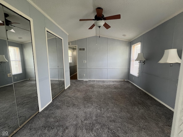 3161 Compass Dr, Franklin, IN 46131 - unfurnished bedroom with crown molding, two closets, multiple windows, carpet floors, and a textured ceiling