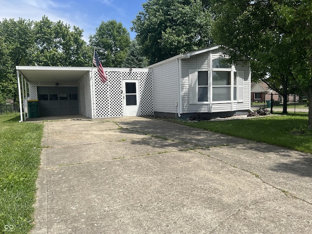 3161 Compass Dr, Franklin, IN 46131 - view of side of home with driveway, an attached garage, and an attached carport