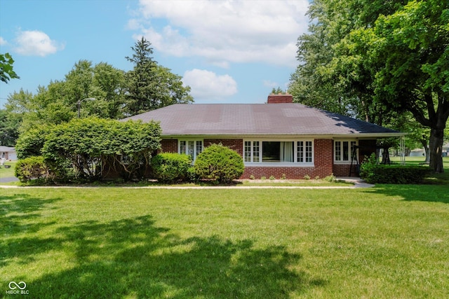 4232 Linden Ln, Anderson, IN 46011 - ranch-style home with a front lawn, brick siding, and a chimney