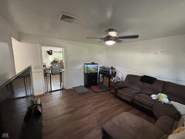 2015 Rosewood Dr, Anderson, IN 46011 - living area featuring dark wood-style flooring, ceiling fan, and baseboards