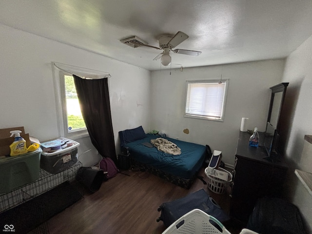 2015 Rosewood Dr, Anderson, IN 46011 - bedroom with wood finished floors, multiple windows, and ceiling fan
