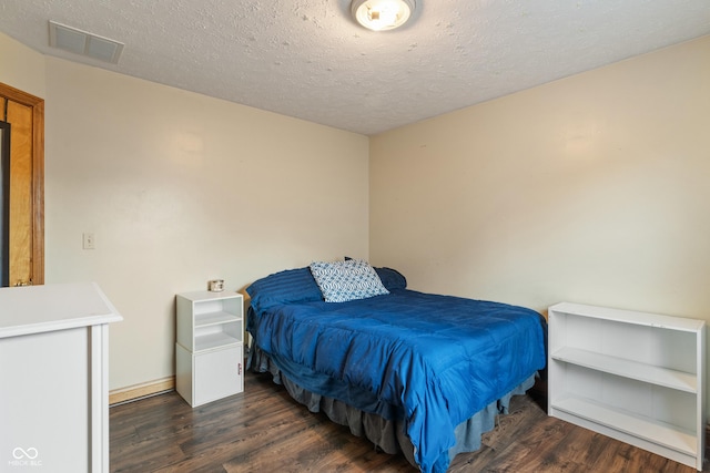485 Mesa Dr, Russiaville, IN 46979 - bedroom featuring wood finished floors, a textured ceiling, and baseboards