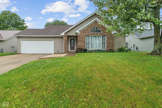 485 Mesa Dr, Russiaville, IN 46979 - view of front of house featuring an attached garage, driveway, and a front yard