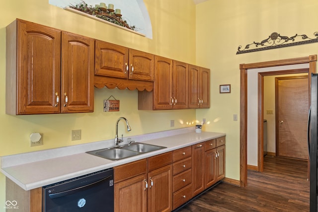 485 Mesa Dr, Russiaville, IN 46979 - kitchen featuring black dishwasher, a sink, dark wood-type flooring, light countertops, and brown cabinetry