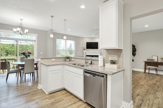 8266 Glacier Ridge Dr, Fishers, IN 46038 - kitchen featuring stainless steel dishwasher, a sink, decorative backsplash, light wood-type flooring, and recessed lighting
