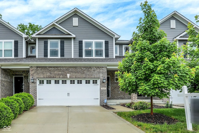8266 Glacier Ridge Dr, Fishers, IN 46038 - view of front of house featuring brick siding, concrete driveway, and a garage