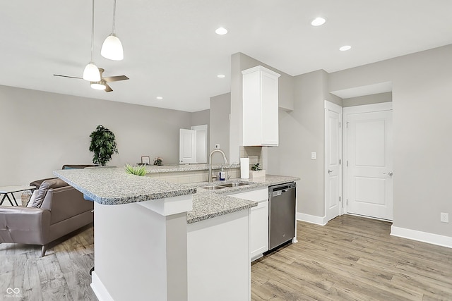 8266 Glacier Ridge Dr, Fishers, IN 46038 - kitchen featuring dishwasher, a sink, a peninsula, light wood-style flooring, and recessed lighting