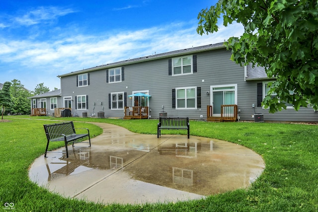 8266 Glacier Ridge Dr, Fishers, IN 46038 - back of house featuring a patio, a yard, and central AC