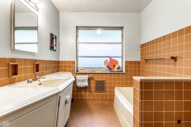 6220 Spring Mill Rd, Indianapolis, IN 46260 - bathroom featuring tile walls, vanity, a wainscoted wall, a bathtub, and tile patterned flooring